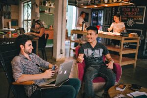 Two men chatting in a co-living space.
